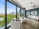 Bright living room with floor to ceiling windows showcasing a beautiful city and lake view at 132 Mirror Lake N Dr # 501, St Petersburg, FL 33701