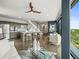Open concept living room and kitchen with hardwood floors and modern design elements at 132 Mirror Lake N Dr # 501, St Petersburg, FL 33701