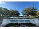 Mirror Lake Park signage with a scenic view of trees, flowers, and the lake at 132 Mirror Lake N Dr # 501, St Petersburg, FL 33701
