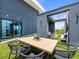 Chic outdoor patio with dining area, lounge seating, and cityscape views, perfect for urban entertaining and relaxation at 132 Mirror Lake N Dr # 501, St Petersburg, FL 33701