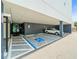 Covered parking space, accessible entry with handicapped parking and unit number above at 132 Mirror Lake N Dr # 501, St Petersburg, FL 33701