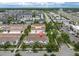 Aerial view of townhomes showcases the community layout, green spaces, proximity to roadways, and well-maintained landscaping at 13306 Wildgrass Trl, Odessa, FL 33556