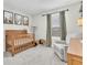Bedroom features woodland themed decor and chair at 13306 Wildgrass Trl, Odessa, FL 33556