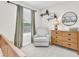 Bedroom features woodland themed decor, chair, and bureau at 13306 Wildgrass Trl, Odessa, FL 33556