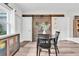 Eat-in kitchen features sliding barn doors, and modern décor at 13306 Wildgrass Trl, Odessa, FL 33556