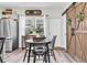 Eat-in kitchen features sliding barn doors, and stainless steel appliances at 13306 Wildgrass Trl, Odessa, FL 33556