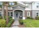 Close-up view of the home's entrance, highlighting the stone facade and covered porch at 13306 Wildgrass Trl, Odessa, FL 33556