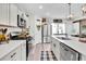 Stylish kitchen with stainless steel appliances, ample counter space, and a pantry at 13306 Wildgrass Trl, Odessa, FL 33556