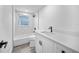 Modern bathroom features a shower-tub combo with stylish tiling, a new toilet, and sleek sink vanity at 13715 Maria Dr, Hudson, FL 34667