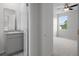 Well-lit bathroom with a modern vanity, granite countertop and walk-in shower at 13919 Wineberry Dr, Dade City, FL 33525