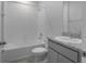 Bathroom with shower and tub combination, sink, toilet, and granite countertop at 13919 Wineberry Dr, Dade City, FL 33525