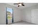 Bedroom with carpet, ceiling fan, and natural light from the window at 13919 Wineberry Dr, Dade City, FL 33525