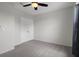 Clean bedroom featuring a ceiling fan, carpet, and closet at 13919 Wineberry Dr, Dade City, FL 33525