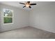 Neutral bedroom with ceiling fan and nice window view at 13919 Wineberry Dr, Dade City, FL 33525