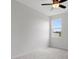Bright bedroom with carpet and large window at 13919 Wineberry Dr, Dade City, FL 33525
