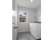 Laundry room featuring a window view and washer and dryer at 13919 Wineberry Dr, Dade City, FL 33525