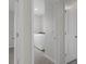 Bright laundry room with white washer and dryer and tiled flooring at 13919 Wineberry Dr, Dade City, FL 33525