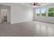 Open living room with large windows offering lots of natural light at 13919 Wineberry Dr, Dade City, FL 33525