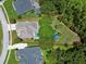 Aerial view of property showing lot size, pool, play area, and surrounding landscape at 1460 Kensington Woods Dr, Lutz, FL 33549