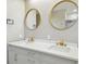 The dual vanity in the bathroom features modern fixtures and beautiful hardware at 1460 Kensington Woods Dr, Lutz, FL 33549