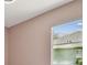 Bedroom featuring a large window for natural light and neutral wall color at 1460 Kensington Woods Dr, Lutz, FL 33549
