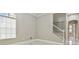 Bedroom featuring marble tile flooring, closet, and staircase access at 1460 Kensington Woods Dr, Lutz, FL 33549