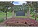 Kensington Estates community sign surrounded by lush greenery, enhancing its welcoming appeal at 1460 Kensington Woods Dr, Lutz, FL 33549