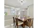 Elegant dining room featuring columns, marble floors, and a large table perfect for entertaining at 1460 Kensington Woods Dr, Lutz, FL 33549