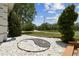 Unique landscaping feature with decorative rocks and shrubbery complementing the natural surroundings at 1460 Kensington Woods Dr, Lutz, FL 33549