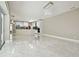 Open-concept living room with views of the kitchen at 1460 Kensington Woods Dr, Lutz, FL 33549
