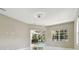 Bright living room with pool view and fan at 1460 Kensington Woods Dr, Lutz, FL 33549