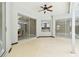 Spacious outdoor patio with sliding glass doors and a ceiling fan, perfect for entertaining at 1460 Kensington Woods Dr, Lutz, FL 33549