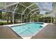 Enjoy this stunning screened in pool area, perfect for entertaining or relaxation at 1460 Kensington Woods Dr, Lutz, FL 33549