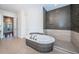 Bathroom featuring an oval tub, sleek shower, and modern fixtures at 147 Bay Point Ne Dr, St Petersburg, FL 33704