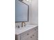 Bathroom featuring a vanity with elegant fixtures and marble countertops at 147 Bay Point Ne Dr, St Petersburg, FL 33704