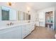 Bathroom featuring dual vanities, modern lighting, and high-end fixtures at 147 Bay Point Ne Dr, St Petersburg, FL 33704