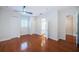 Bright bedroom with hardwood floors, ceiling fan, and multiple closets at 147 Bay Point Ne Dr, St Petersburg, FL 33704