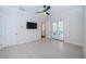 Bright bedroom with recessed lights, and double doors leading to a balcony for outdoor enjoyment at 147 Bay Point Ne Dr, St Petersburg, FL 33704
