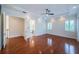 Large bedroom with hardwood floors, recessed lighting, and a doorway leading to the bathroom at 147 Bay Point Ne Dr, St Petersburg, FL 33704