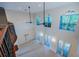 Open foyer showcasing soaring ceilings, arched windows, and access to outdoor spaces at 147 Bay Point Ne Dr, St Petersburg, FL 33704