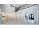 Spacious great room with soaring ceilings, white columns, and a chef's kitchen in the background at 147 Bay Point Ne Dr, St Petersburg, FL 33704