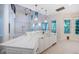 Open-concept kitchen with white marble countertops, a center island, and pendant lighting at 147 Bay Point Ne Dr, St Petersburg, FL 33704