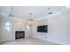 Inviting living room with modern fireplace, recessed lighting, and a large flatscreen TV at 147 Bay Point Ne Dr, St Petersburg, FL 33704