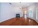 Elegant living room featuring hardwood floors, fireplace and large windows at 147 Bay Point Ne Dr, St Petersburg, FL 33704