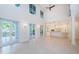 Open floor plan featuring a combined living room and kitchen area, lots of natural light, and tile floors at 147 Bay Point Ne Dr, St Petersburg, FL 33704