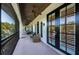 Spacious covered patio with comfortable seating, ceiling fans, and beautiful backyard views at 147 Bay Point Ne Dr, St Petersburg, FL 33704