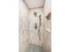 Detailed view of the shower featuring unique tile work, bronze fixtures, and shower niche at 147 Bay Point Ne Dr, St Petersburg, FL 33704
