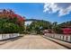 Welcome to Bay Point Drive: picturesque street entrance with lush flowering trees at 147 Bay Point Ne Dr, St Petersburg, FL 33704