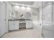 Bathroom features a double vanity, soaking tub, and a separate glass shower at 1528 Riverdale Dr, Oldsmar, FL 34677