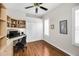 Bedroom/Office with built-in storage, desk, and wood-look floors at 1528 Riverdale Dr, Oldsmar, FL 34677